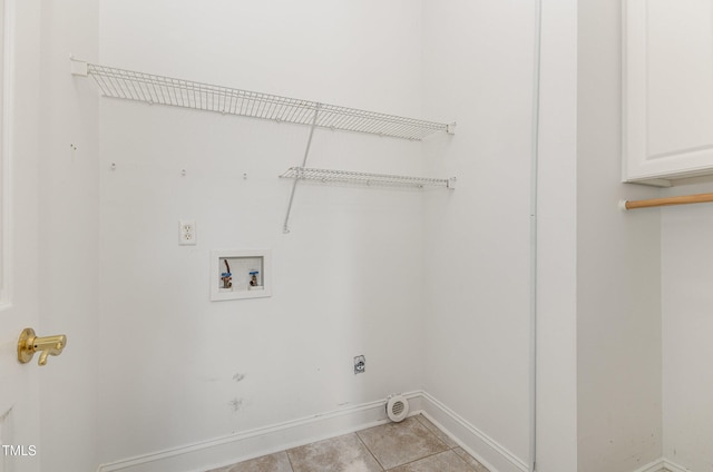 washroom with cabinets, hookup for a washing machine, light tile patterned floors, and electric dryer hookup