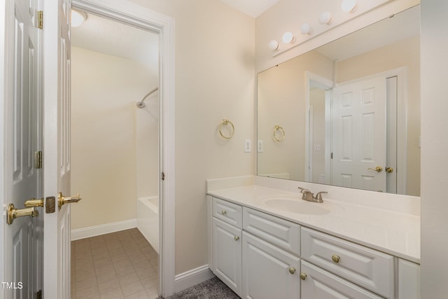 bathroom featuring vanity and shower / bathtub combination