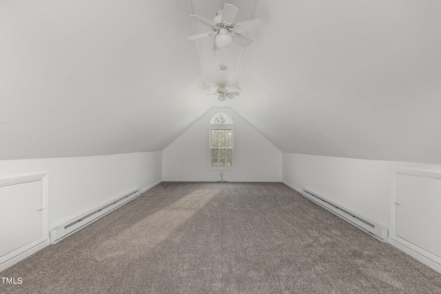 additional living space with ceiling fan, vaulted ceiling, carpet floors, and a baseboard heating unit