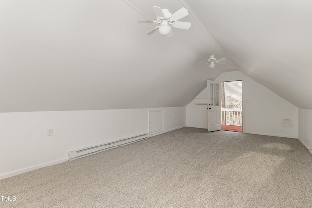 additional living space featuring carpet flooring, ceiling fan, vaulted ceiling, and a baseboard heating unit