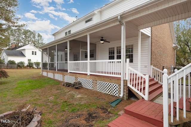 exterior space with a lawn and a sunroom