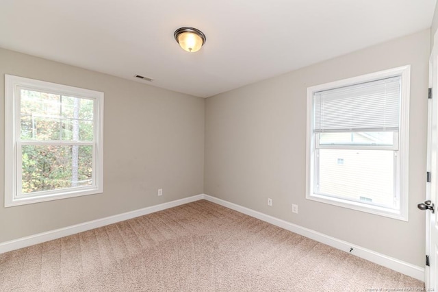 spare room with carpet flooring