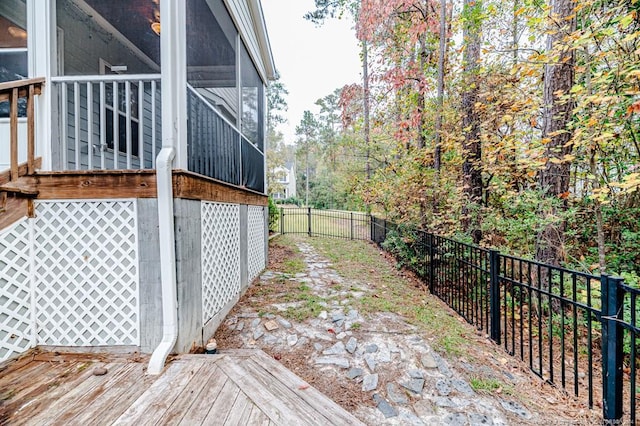 view of side of property featuring a sunroom