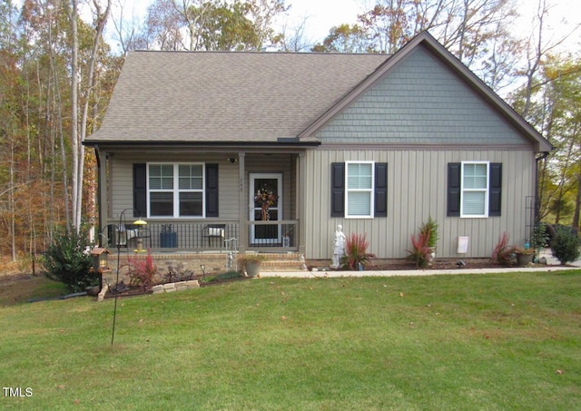 view of front of house featuring a porch and a front lawn