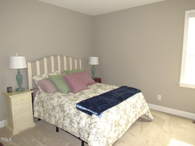 bedroom with light carpet