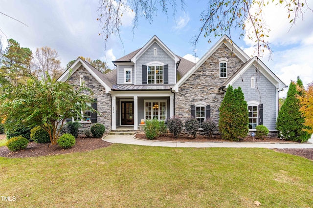 craftsman inspired home with a front yard