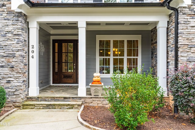 entrance to property featuring a porch