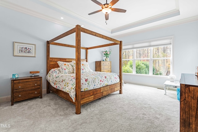 bedroom with light colored carpet, ceiling fan, and crown molding