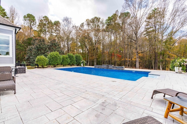 view of swimming pool with a patio area