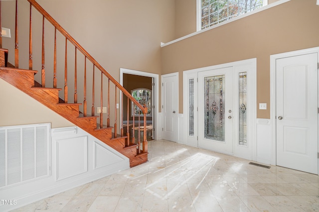 entryway with a high ceiling