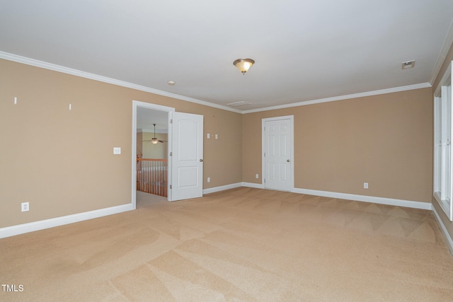 carpeted empty room with ornamental molding and ceiling fan