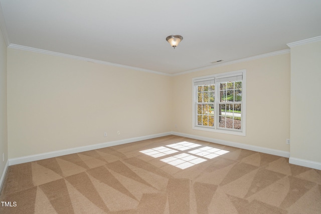 empty room with carpet flooring and ornamental molding