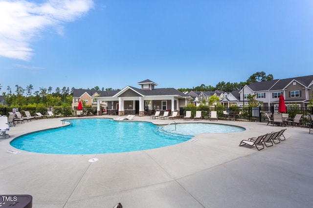 view of swimming pool with a patio area