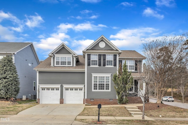 traditional-style home featuring central air condition unit, a garage, driveway, crawl space, and roof with shingles