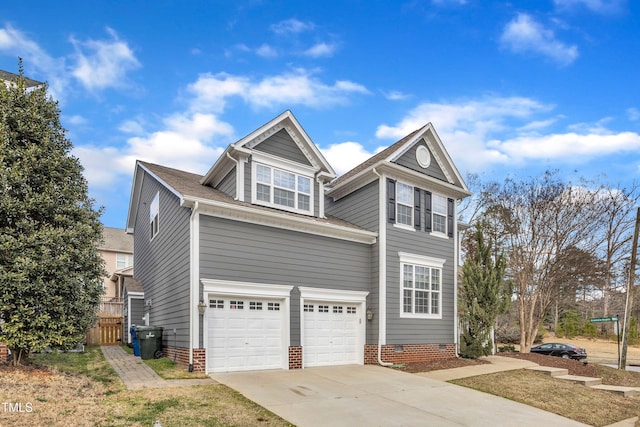 traditional home with a garage, concrete driveway, crawl space, and fence