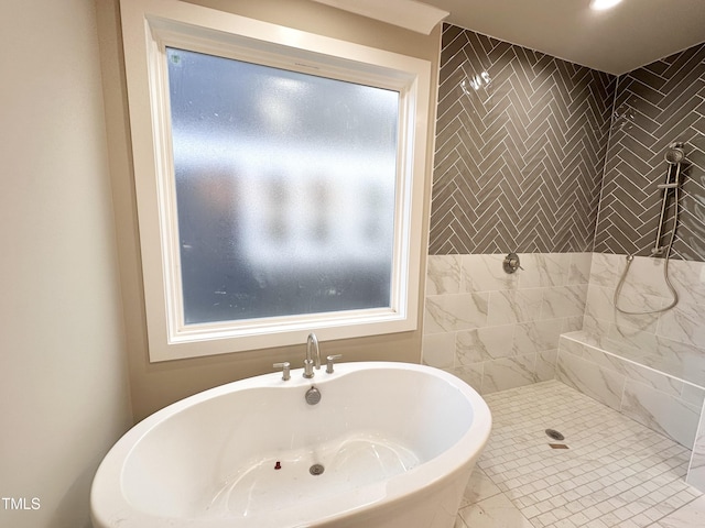 bathroom with plus walk in shower and a wealth of natural light