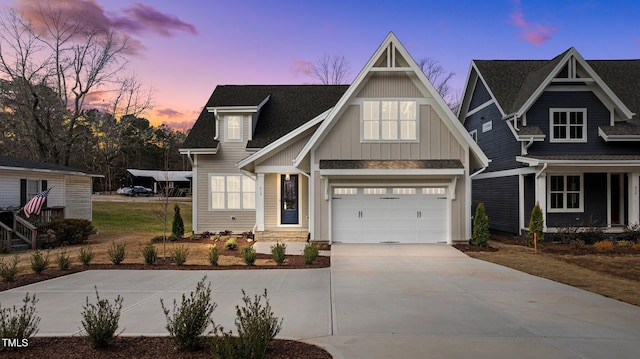 view of front of property featuring a garage and driveway