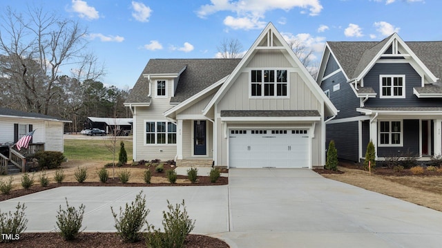 view of front of property featuring driveway, a garage, board and batten siding, and roof with shingles