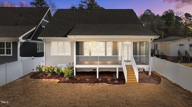 back of house featuring crawl space, a fenced backyard, stairs, and roof with shingles