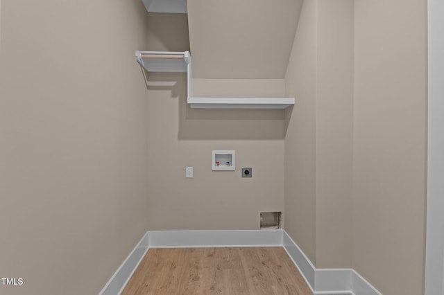 laundry area featuring hookup for an electric dryer, laundry area, washer hookup, wood finished floors, and baseboards