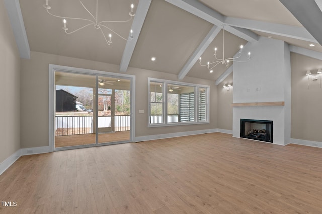 unfurnished living room featuring a fireplace, wood finished floors, beam ceiling, and baseboards