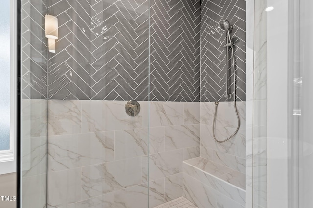 full bath featuring tiled shower