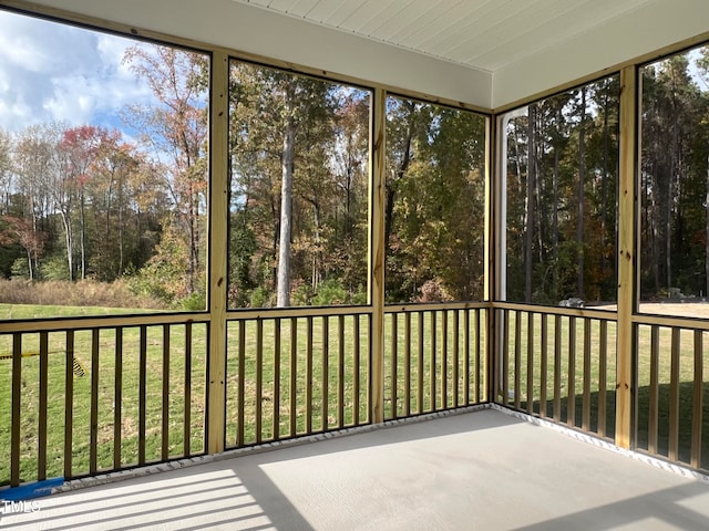 unfurnished sunroom featuring a wealth of natural light