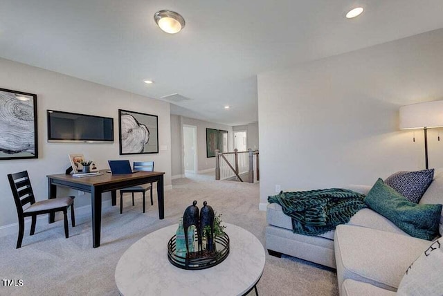 dining area featuring light colored carpet