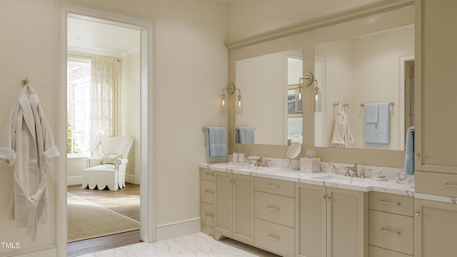 bathroom featuring vanity, hardwood / wood-style flooring, and ornamental molding