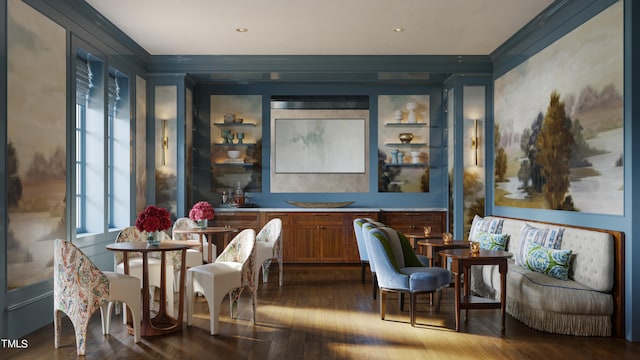 bar with hardwood / wood-style flooring and crown molding