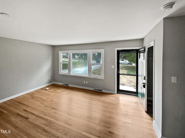 unfurnished room with light hardwood / wood-style flooring