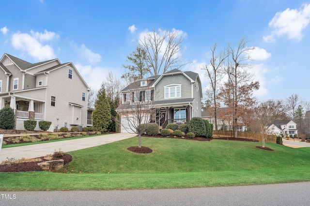 view of front of property featuring a garage and a front yard