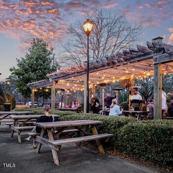 surrounding community with a patio and a pergola