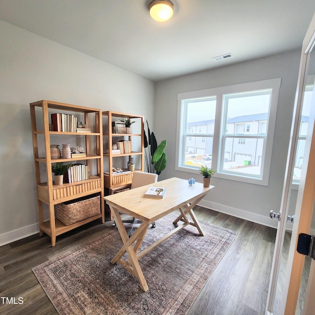 office with dark hardwood / wood-style floors