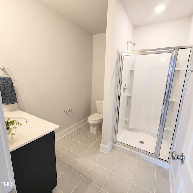 bathroom with an enclosed shower, vanity, tile patterned flooring, and toilet