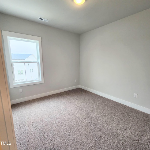 unfurnished room with carpet floors