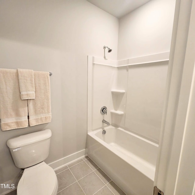 bathroom featuring tile patterned floors, toilet, and shower / washtub combination