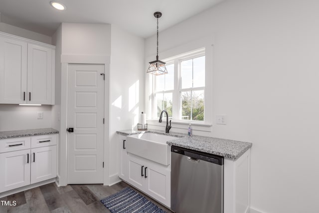 kitchen featuring light stone counters, white cabinetry, dark hardwood / wood-style flooring, pendant lighting, and dishwasher