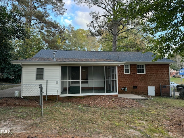 back of property featuring a sunroom