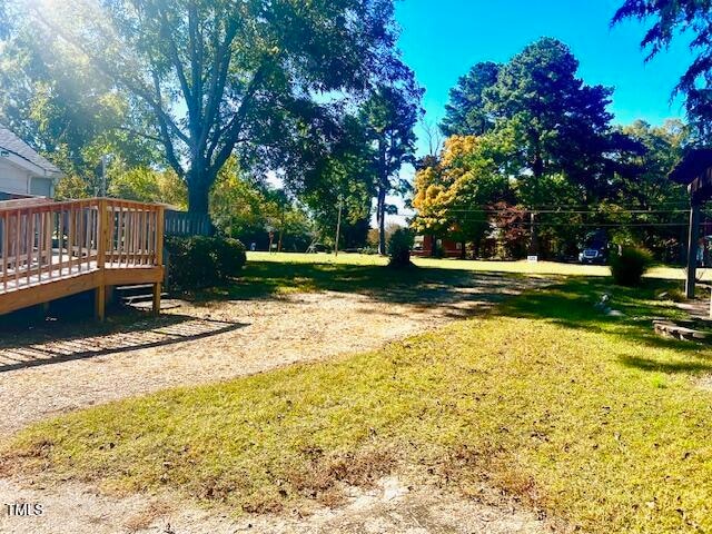 view of yard featuring a wooden deck