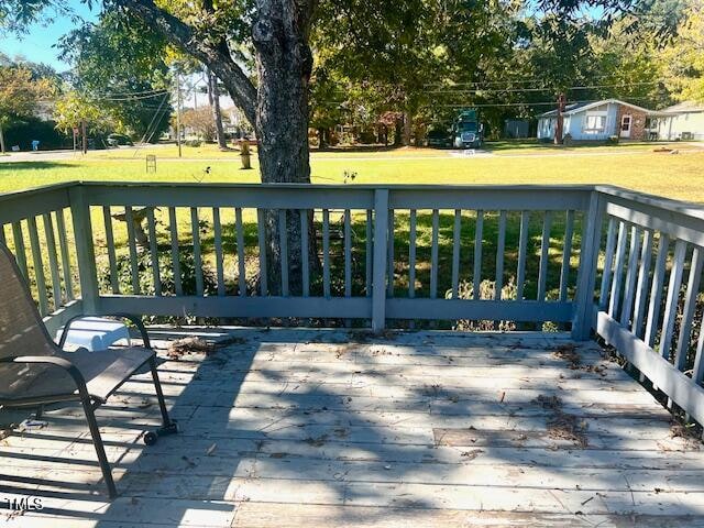 deck featuring a yard