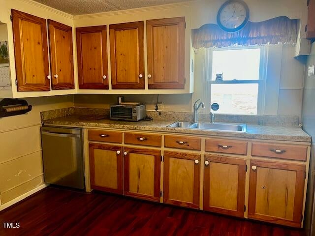 kitchen featuring sink, dark hardwood / wood-style floors, a textured ceiling, crown molding, and dishwasher