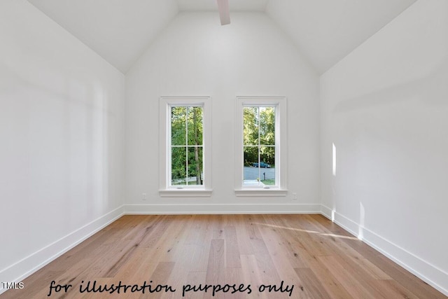 spare room with lofted ceiling and light hardwood / wood-style floors