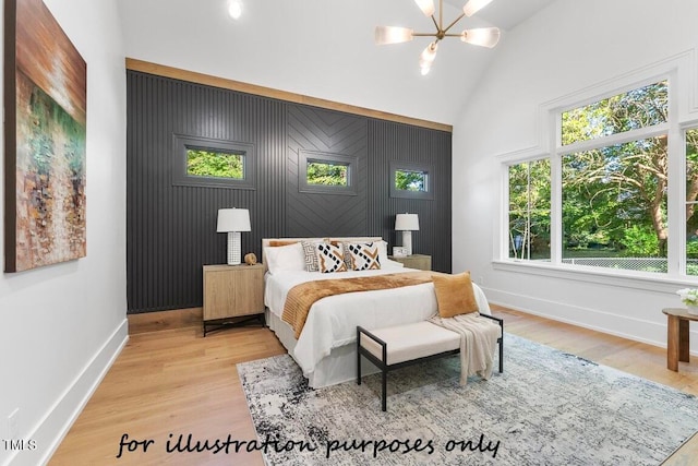 bedroom featuring high vaulted ceiling, a chandelier, and light wood-type flooring