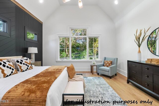 bedroom with high vaulted ceiling and light wood-type flooring