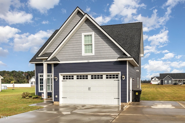 view of front facade with a garage and a front lawn