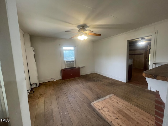 unfurnished room with ornamental molding, cooling unit, dark wood-type flooring, and ceiling fan