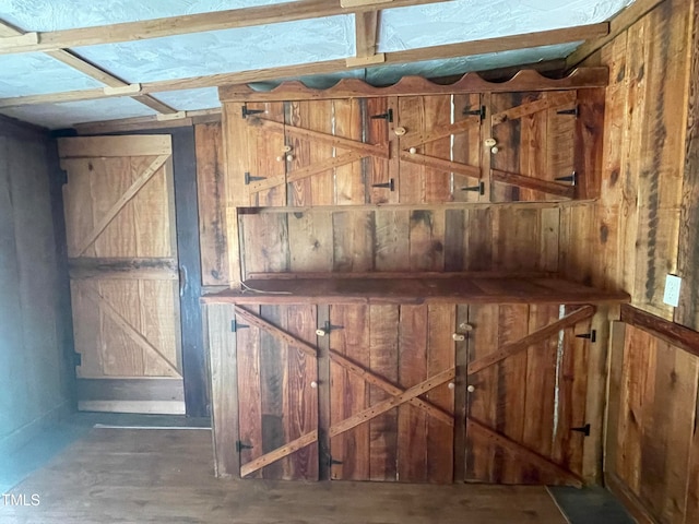 room details with a barn door and wooden walls