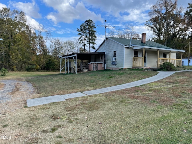 view of front of house with covered porch and a front lawn