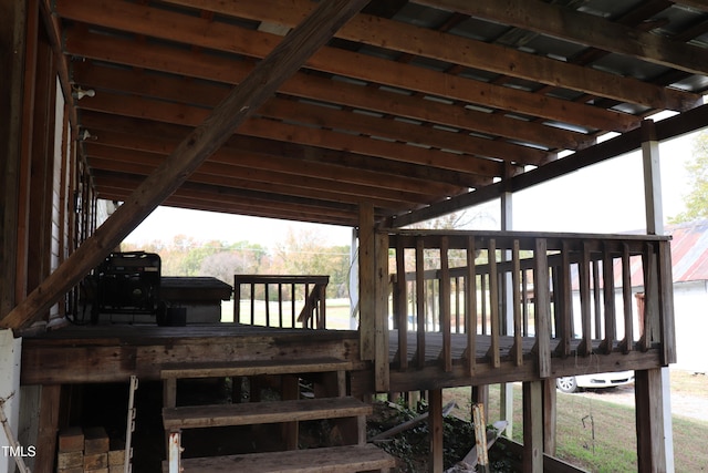 wooden deck featuring a grill